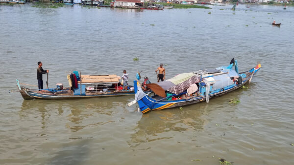 Boat catching fish on river
